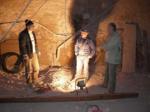 Plumber, mason standing in building site