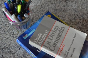 Schoolbooks on desk with pens